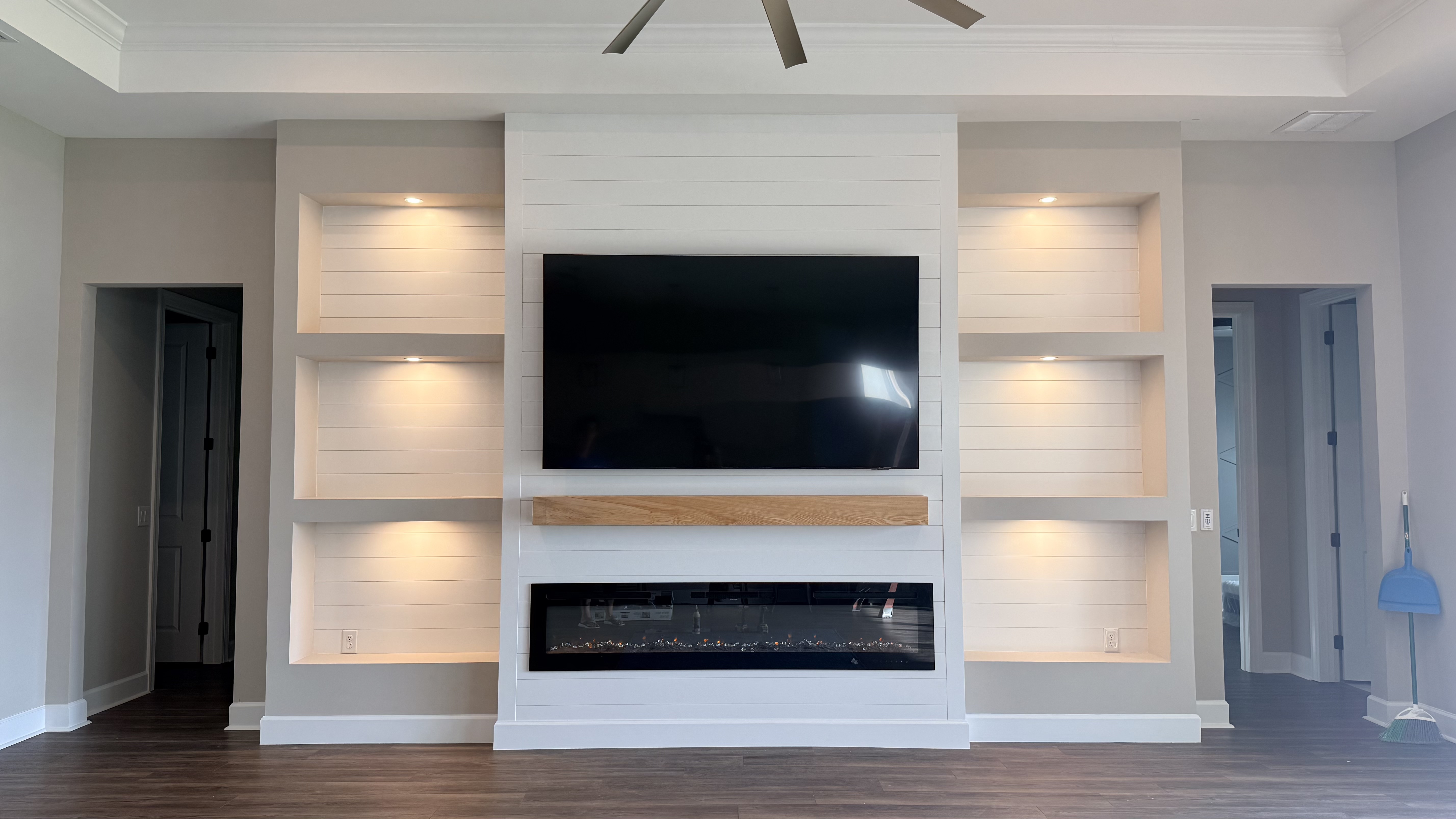 Built-in entertainment system with custom millwork and LED strips